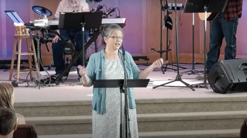 Pastor Jen giving sermon at Corner Stone Church