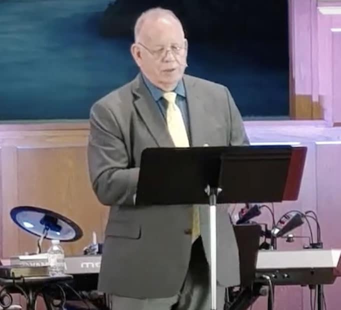 Pastor giving sermon at Corner Stone Church