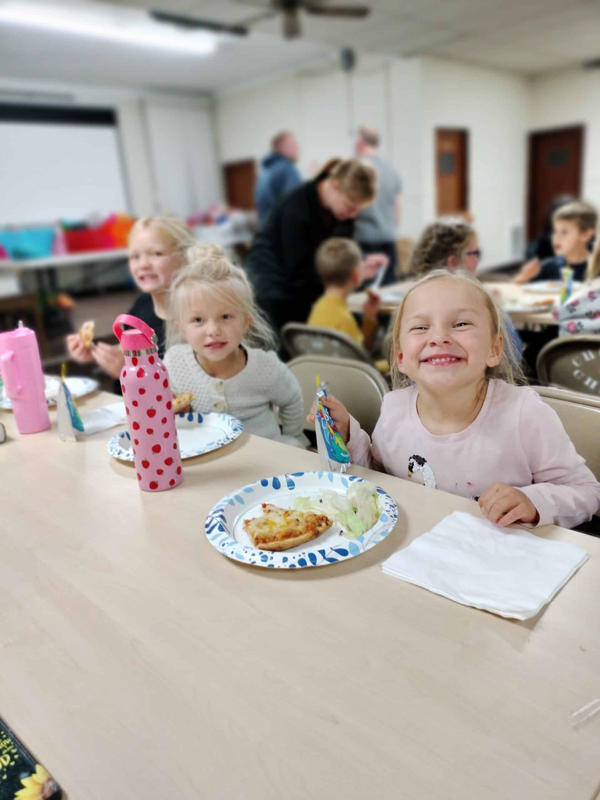 Children Eating Pizza at Corner Stone Church