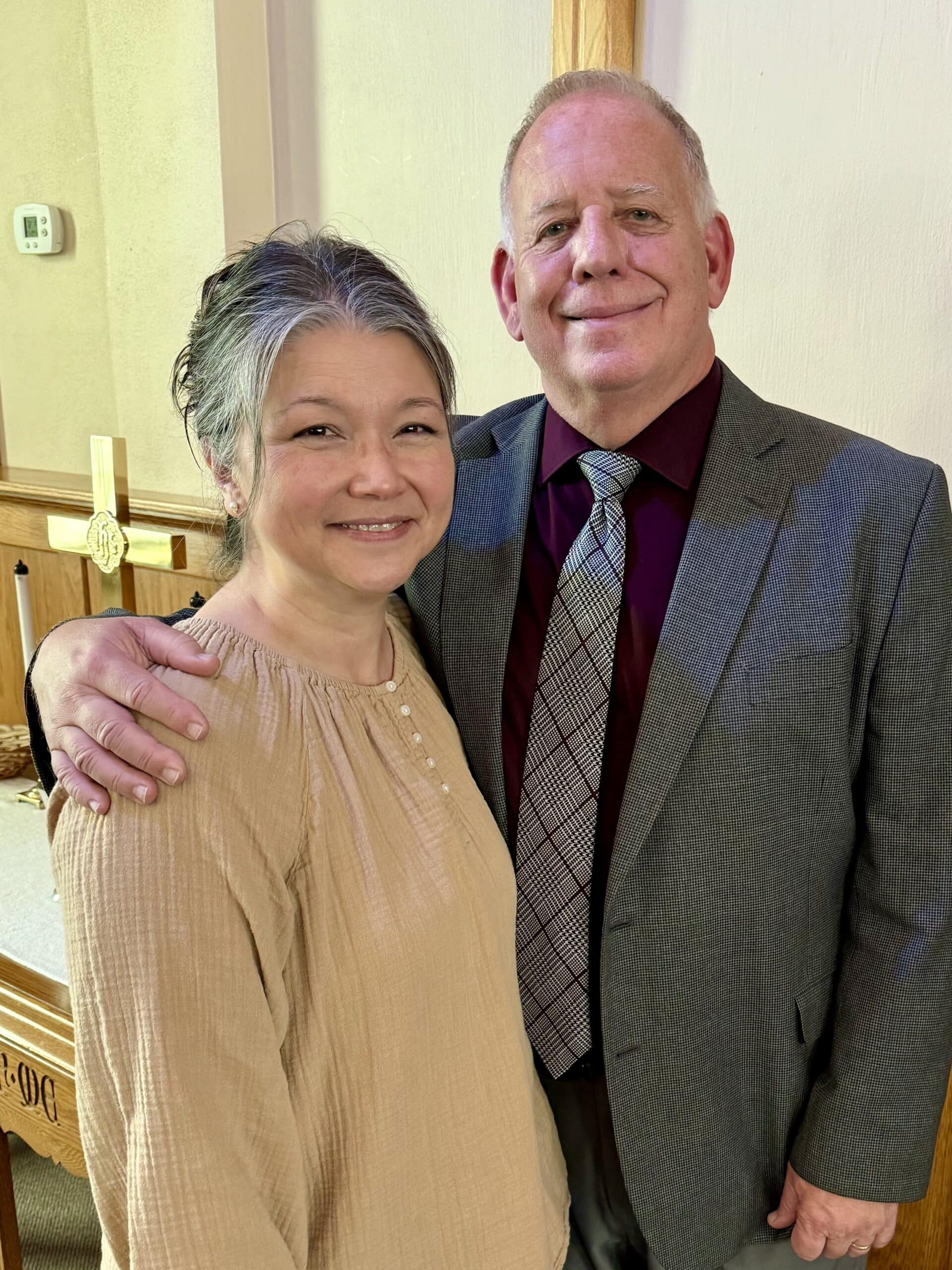 pastor scott and jen standing in Corner Stone Church Welcome Center