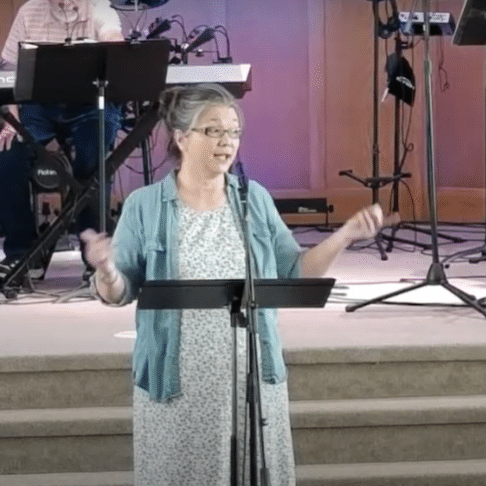 Pastor Jen giving sermon at Corner Stone Church