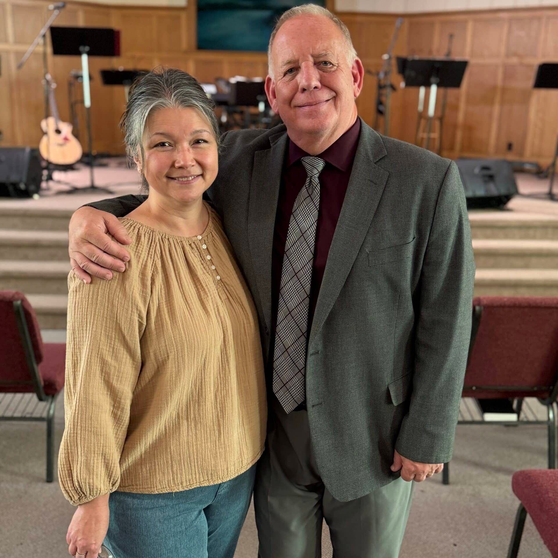 pastor scott and jen standing in Corner Stone Church